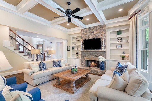 living room featuring beamed ceiling, ceiling fan, baseboards, and coffered ceiling