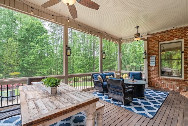 wooden terrace with ceiling fan, an outdoor hangout area, and outdoor dining space