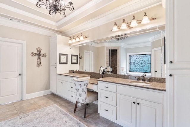 bathroom with crown molding, tile patterned floors, an inviting chandelier, and vanity