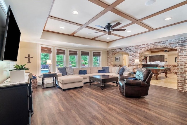 living area with ceiling fan, arched walkways, billiards, wood finished floors, and coffered ceiling