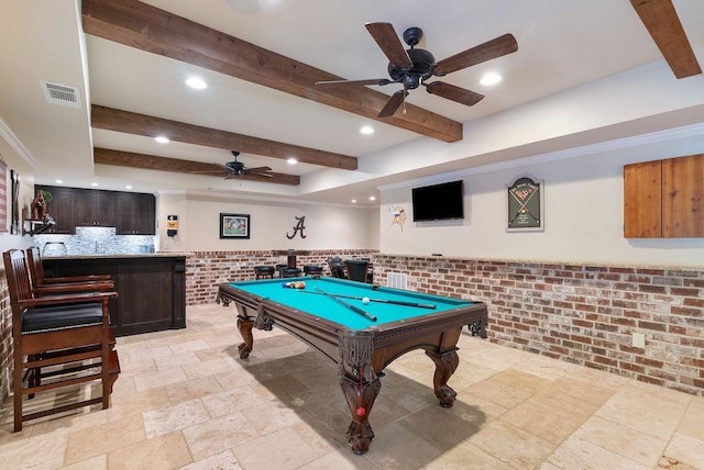 game room featuring beamed ceiling, ceiling fan, stone tile floors, and visible vents