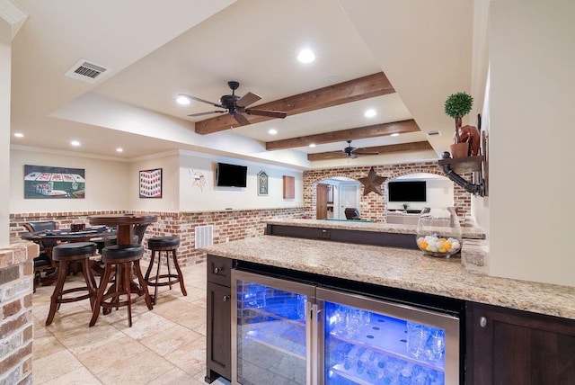 bar with ceiling fan, a bar, and wine cooler