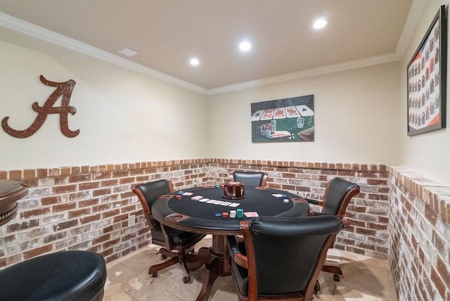 game room featuring recessed lighting, ornamental molding, and a wainscoted wall