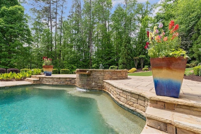 outdoor pool featuring a patio