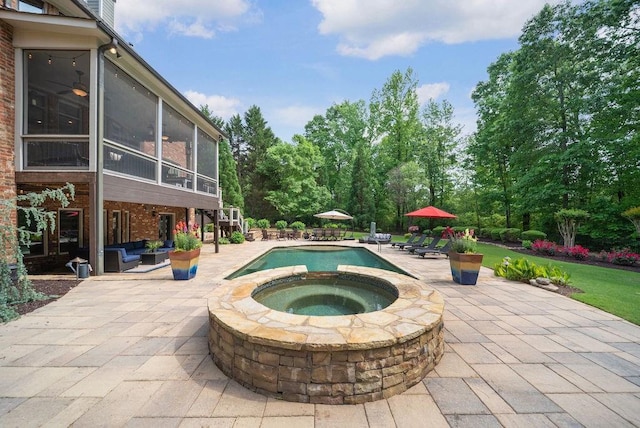 pool featuring an outdoor living space, a patio area, a sunroom, and an in ground hot tub