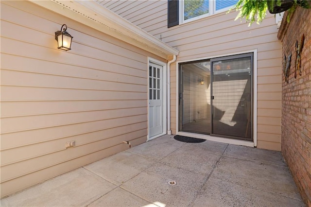 entrance to property with a patio area