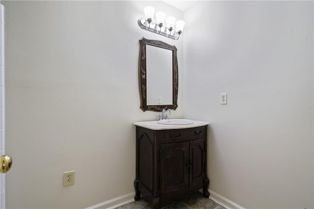 bathroom with vanity and baseboards