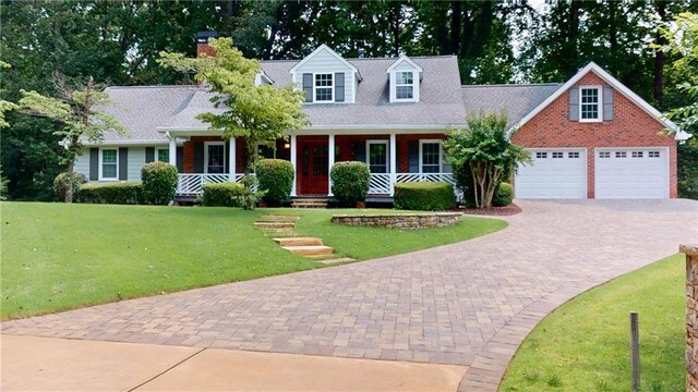 1477 Triple Creek Ct NW, Kennesaw, GA 30144 - cape cod house with covered porch, driveway, a front lawn, a garage, and a chimney