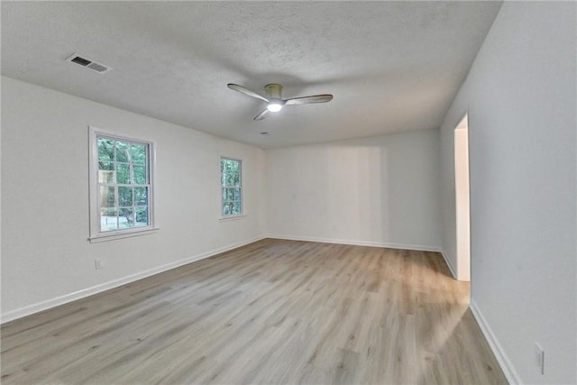 315 N Fayette Dr, Fayetteville, GA 30214 - empty room with wood finished floors, ceiling fan, baseboards, and a textured ceiling