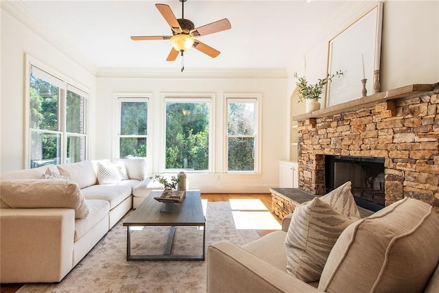 sunroom / solarium featuring a fireplace, a wealth of natural light, and ceiling fan