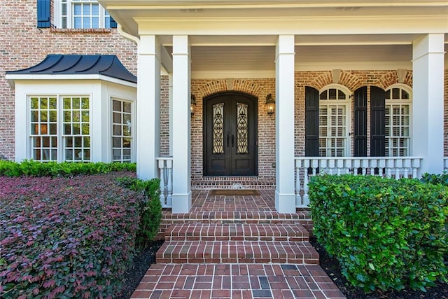 property entrance featuring covered porch