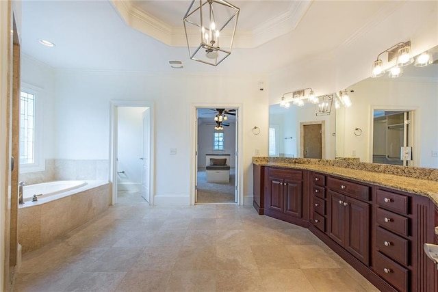 bathroom featuring ceiling fan, vanity, and crown molding