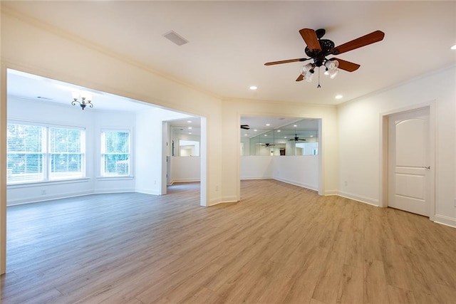 unfurnished living room with ornamental molding, light wood-type flooring, and ceiling fan