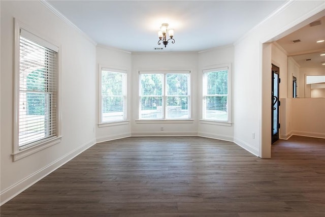 unfurnished room with a chandelier, dark hardwood / wood-style floors, and crown molding