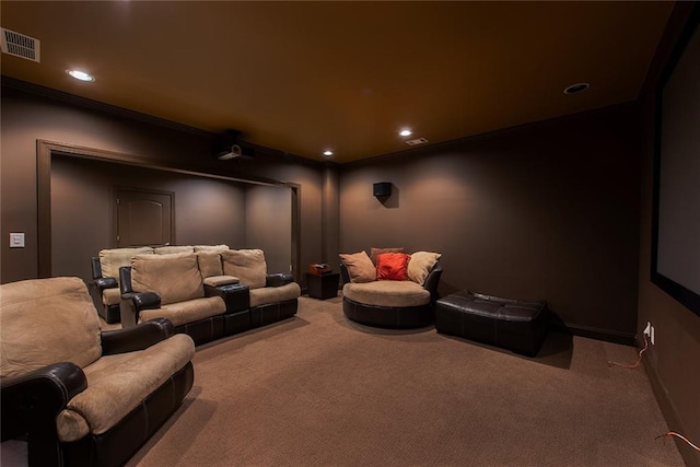 home theater with carpet flooring and ornamental molding