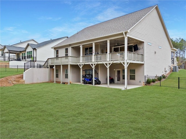 back of house featuring a patio area, a fenced backyard, a lawn, and central AC