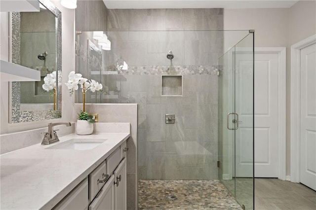 bathroom with vanity and a shower stall