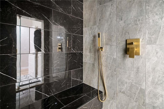 full bath featuring tiled shower