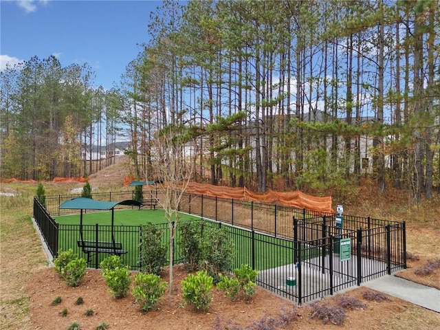 view of community featuring fence