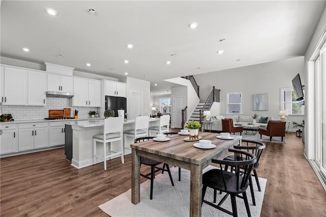 4011 Fallen Leaf Ct, Kennesaw, GA 30152 - dining room featuring stairway, wood finished floors, and recessed lighting