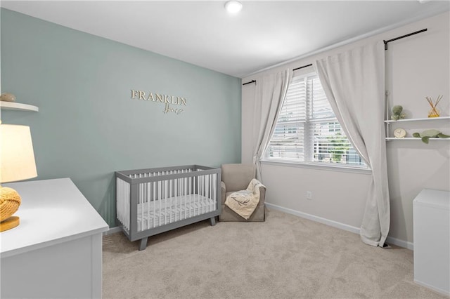 4011 Fallen Leaf Ct, Kennesaw, GA 30152 - carpeted bedroom with a crib and baseboards