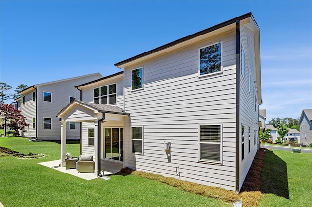 4011 Fallen Leaf Ct, Kennesaw, GA 30152 - rear view of house featuring a lawn and a patio area