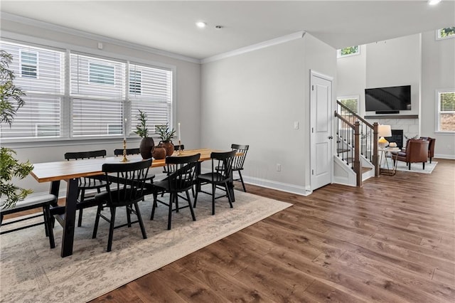 4011 Fallen Leaf Ct, Kennesaw, GA 30152 - dining area featuring ornamental molding, wood finished floors, baseboards, healthy amount of natural light, and recessed lighting