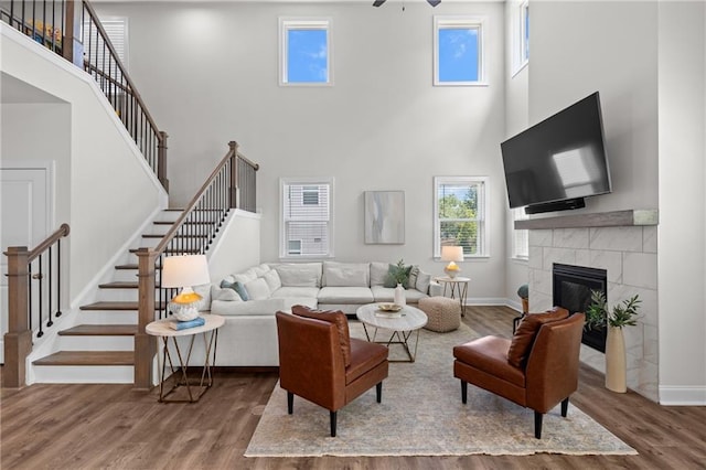 4011 Fallen Leaf Ct, Kennesaw, GA 30152 - living area with a towering ceiling, ceiling fan, wood finished floors, and stairway