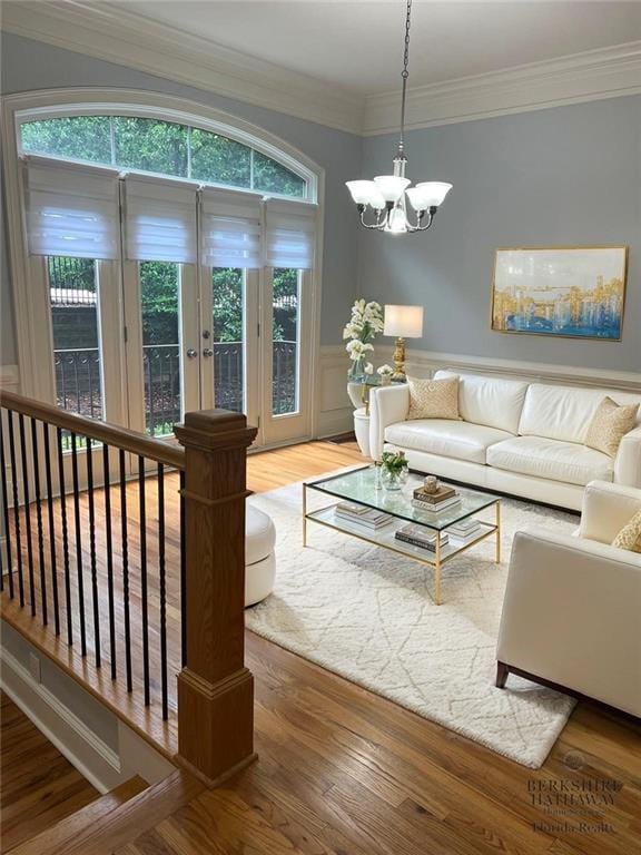 2380 Crescent Park Ct Unit 4, Atlanta, GA 30339 - living room featuring a chandelier, wood finished floors, crown molding, french doors, and wainscoting
