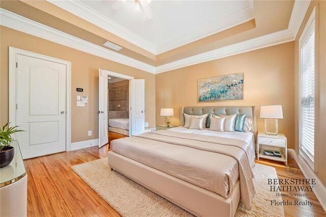2380 Crescent Park Ct Unit 4, Atlanta, GA 30339 - bedroom with a tray ceiling, light wood-type flooring, ornamental molding, and baseboards