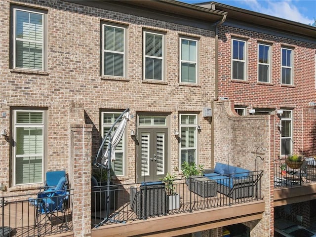 2380 Crescent Park Ct Unit 4, Atlanta, GA 30339 - rear view of house featuring brick siding and a balcony