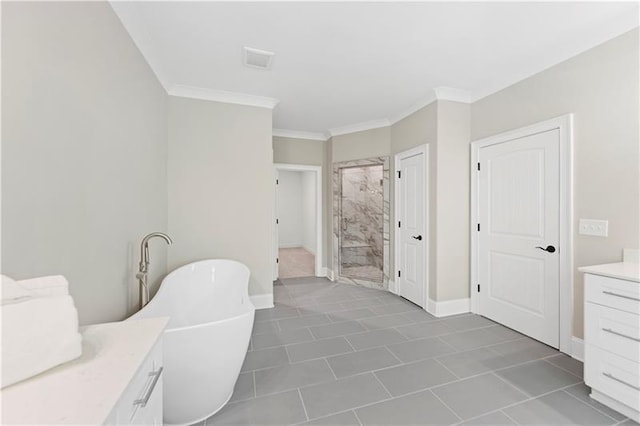 bathroom featuring vanity, a tub to relax in, and crown molding