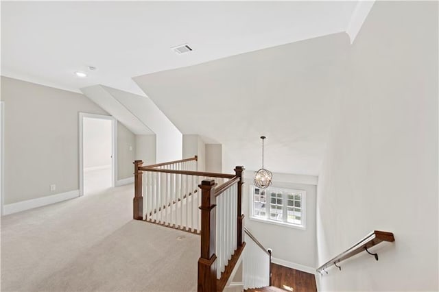 interior space featuring lofted ceiling and a notable chandelier