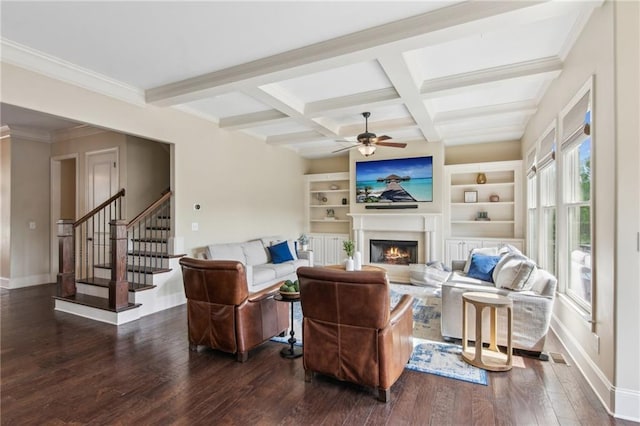673 Dunbrody Dr, Milton, GA 30004 - living room featuring a ceiling fan, a lit fireplace, dark wood-type flooring, beam ceiling, and baseboards