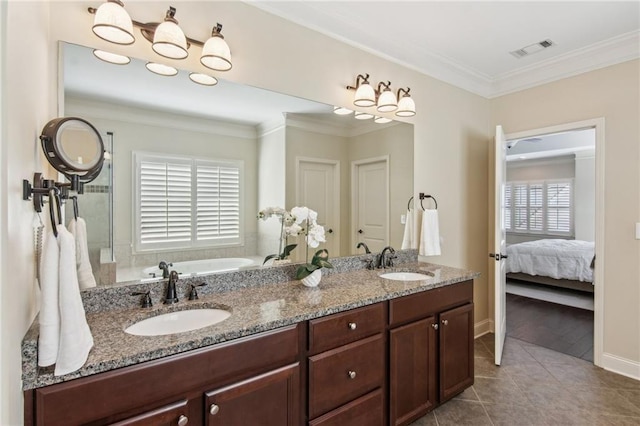 673 Dunbrody Dr, Milton, GA 30004 - ensuite bathroom featuring a bath, tile patterned floors, crown molding, double vanity, and baseboards