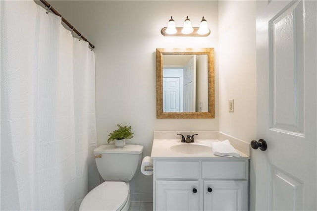 full bathroom with toilet and vanity