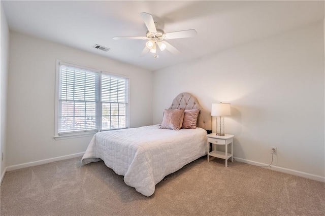 bedroom featuring a ceiling fan, carpet, visible vents, and baseboards