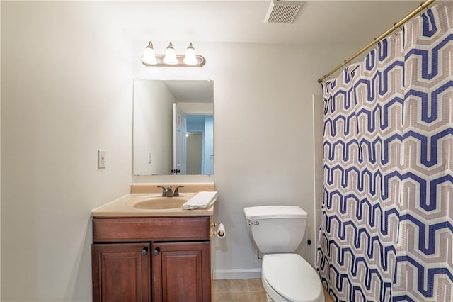 bathroom with visible vents, toilet, tile patterned flooring, baseboards, and vanity