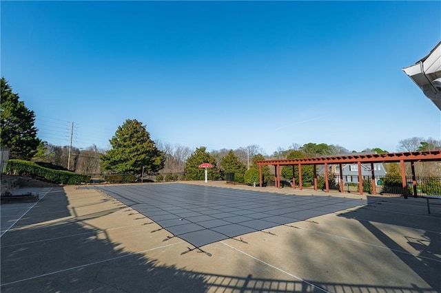 community pool with a patio, fence, and a pergola