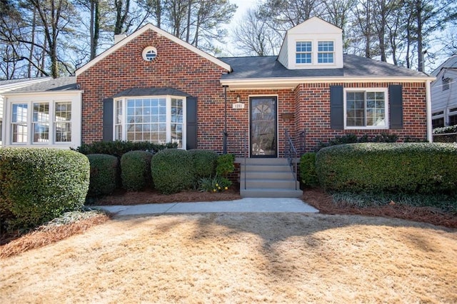 view of front of home featuring brick siding