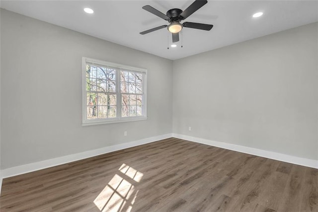 unfurnished room with ceiling fan, baseboards, wood finished floors, and recessed lighting