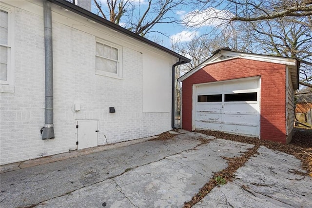 detached garage featuring driveway