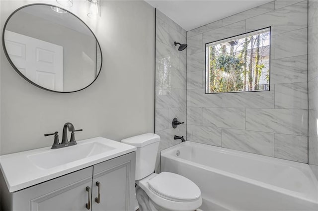 bathroom with vanity, toilet, and bathing tub / shower combination