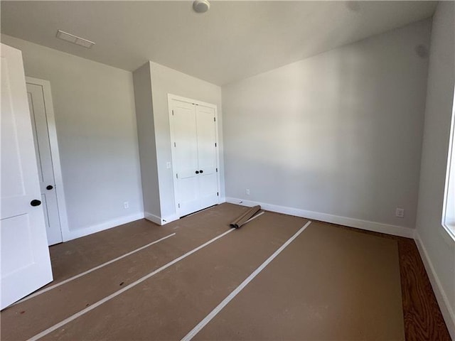 3 Outpost Trl SE, Rome, GA 30161 - unfurnished bedroom featuring baseboards and a closet