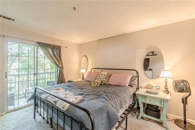 215 Cobblestone Trl, Avondale Estates, GA 30002 - bedroom with access to exterior, a textured ceiling, carpet floors, and baseboards