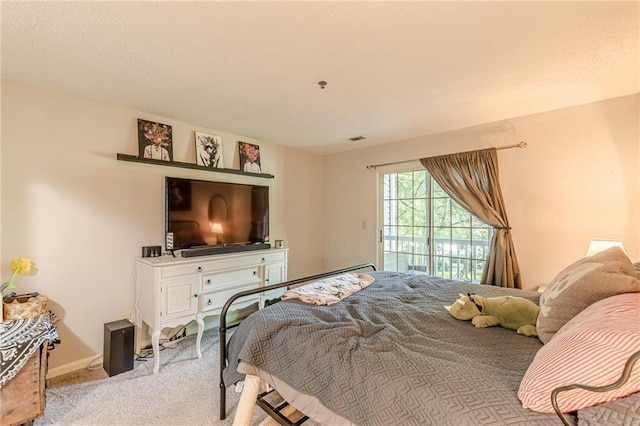 215 Cobblestone Trl, Avondale Estates, GA 30002 - carpeted bedroom featuring access to outside and baseboards