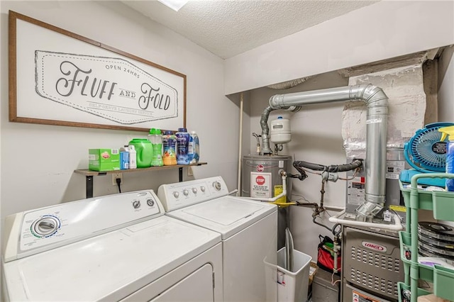 215 Cobblestone Trl, Avondale Estates, GA 30002 - laundry room with washing machine and dryer, a textured ceiling, and water heater