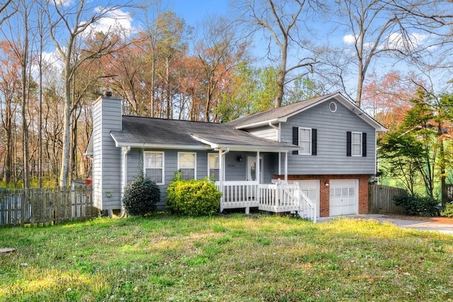 split level home featuring a front lawn and a garage