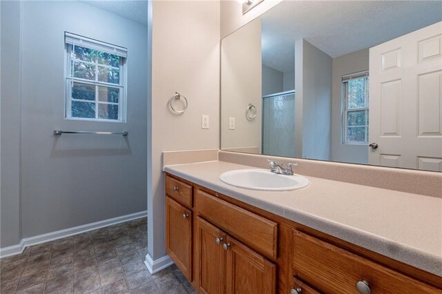 bathroom featuring vanity and walk in shower