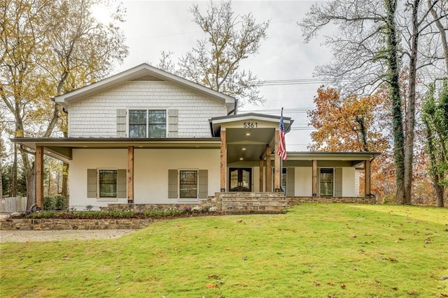 view of front facade featuring french doors and a front lawn